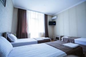 Katil atau katil-katil dalam bilik di Hotel Old Borjomi