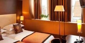 Katil atau katil-katil dalam bilik di Hôtel 85 Saint Honore +53 gambar