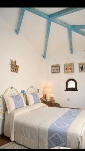 Postel nebo postele na pokoji v ubytování Rooms Romangia + 37 fotografií