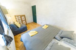 Posteľ alebo postele v izbe v ubytovaní Babylon Apartmány