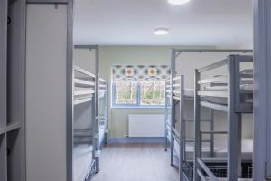 a room with bunk beds and a window at Wild Atlantic Hostel in Leenaun