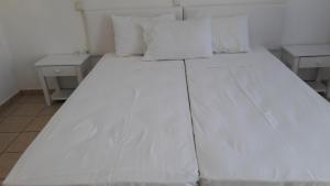 Posteľ alebo postele v izbe v ubytovaní Pavlos Rooms