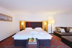 Hotel Garni Testa Grigia tesisinde bir odada yatak veya yataklar