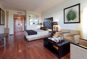 a bedroom with a bed and a living room at Senator Banus Adults Only Recommended in Estepona +94 photos
