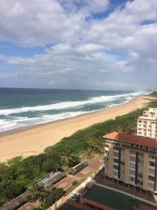an aerial view of a beach and a building at Stella Maris in Amanzimtoti