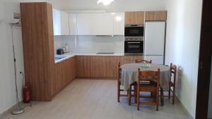 Kuchyň nebo kuchyňský kout v ubytování Dora Apartments + 12 fotografií