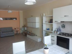 Kuchyňa alebo kuchynka v ubytovaní Conte Caramelli Apartment + 18 fotografií