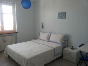 Posteľ alebo postele v izbe v ubytovaní Conte Caramelli Apartment