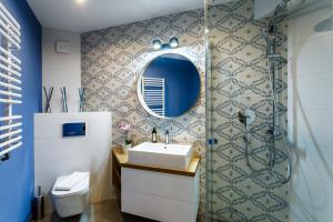 a bathroom with a sink and a mirror at Rent like home - Droga na Bystre in Zakopane