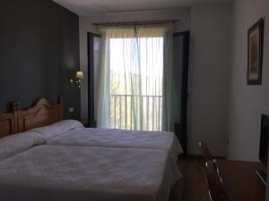 Posteľ alebo postele v izbe v ubytovaní Hotel Cinco Castaños