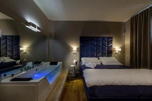Posteľ alebo postele v izbe v ubytovaní Album Boutique Rooms