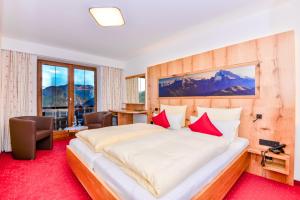 Ein Bett oder Betten in einem Zimmer der Unterkunft Alpenhotel Denninglehen