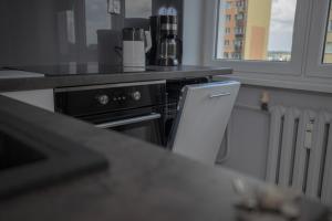 Kuchyňa alebo kuchynka v ubytovaní JDK Apartamenty Podmiejska 38m2 5-osobowy