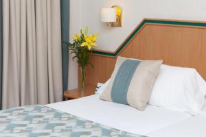 Postel nebo postele na pokoji v ubytování Hotel Praga