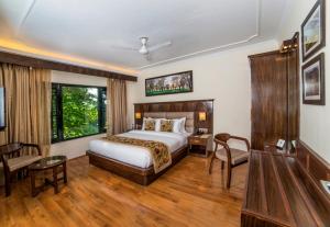 Voodi või voodid majutusasutuse Lemon Tree Hotel Srinagar toas