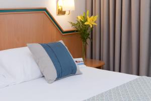 Postel nebo postele na pokoji v ubytování Hotel Praga