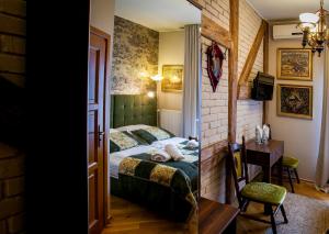 Posteľ alebo postele v izbe v ubytovaní Aparthotel Oberża