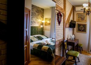 Łóżko lub łóżka w pokoju w obiekcie Aparthotel Oberża