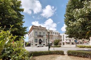 a building on the corner of a street at The Rex Hotel Porto - Mansion House - Private Parking in Porto