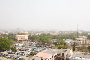 an aerial view of a city with a parking lot at Belanova Apartments and Suites in Abuja