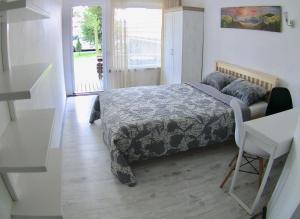 A bed or beds in a room at Vila Junda
