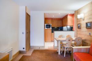 Kuchyň nebo kuchyňský kout v ubytování Residence Les Chalets du Forum - maeva Home
