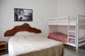 Postel nebo postele na pokoji v ubytování Estalagem Maceió