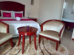 Cama o camas de una habitación en Comfort Palace Guesthouse