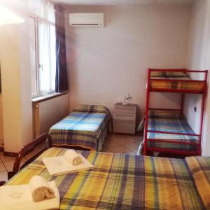Ένα ή περισσότερα κρεβάτια σε δωμάτιο στο Appartamenti Angelo e Maria