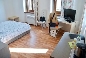 TV in/ali zabaviščno središče v nastanitvi Casa Zen
