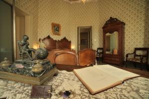Postel nebo postele na pokoji v ubytování Residenza d'Epoca Regina d'Arborea