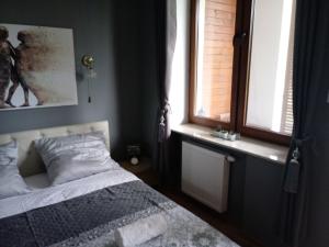 Łóżko lub łóżka w pokoju w obiekcie apartament Fanaberia