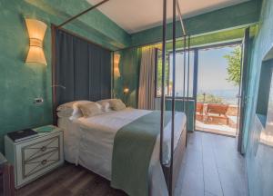 Postel nebo postele na pokoji v ubytování Hotel Villa Ducale + 37 fotografií