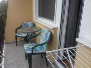 Rõdu või terrass majutusasutuses Harmatcsepp Apartmanház