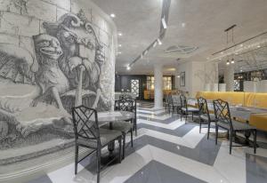 Reštaurácia alebo iné gastronomické zariadenie v ubytovaní Boutique Hotel Corso