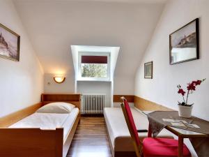 Postel nebo postele na pokoji v ubytování Hotel Olympia