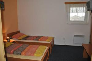 Postel nebo postele na pokoji v ubytování Penzion Kosík Tvrdonice