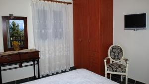 TV a/nebo společenská místnost v ubytování Harmony Villas