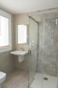 a bathroom with a shower and a sink at Hotel Mica in Palas de Rei +46 photos