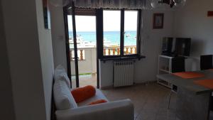 a living room with a view of the ocean at Apartmani Marenda in Supetarska Draga