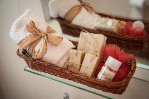 two baskets of towels and soap on a shelf at Iliothea in Nafplio
