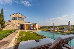a villa with a swimming pool and a house at Villa Casa Daco in Biograd na Moru
