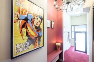 a hallway with a large movie poster on the wall at Best Budget Rooms in Brussels