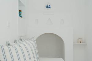 A bed or beds in a room at Aether Boutique Stay