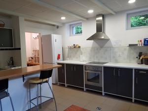 a kitchen with gray cabinets and a counter top at Willa Reverans in Borne Sulinowo