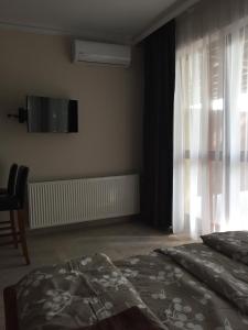 Posteľ alebo postele v izbe v ubytovaní Balaton Kinizsi Apartman