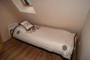 Postel nebo postele na pokoji v ubytování Apartament Góralski