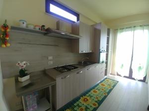 Kuchyňa alebo kuchynka v ubytovaní Sciascia Apartment