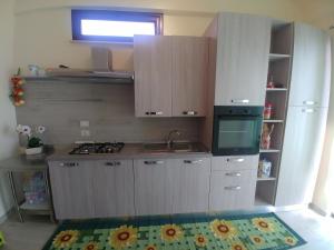 Kuchyňa alebo kuchynka v ubytovaní Sciascia Apartment