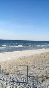 a sandy beach with the ocean in the background at Familie Fritz in Gager +9 photos